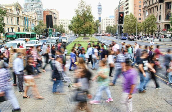 timelapse photo of people passing the street