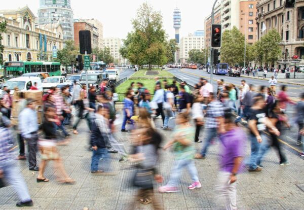 timelapse photo of people passing the street
