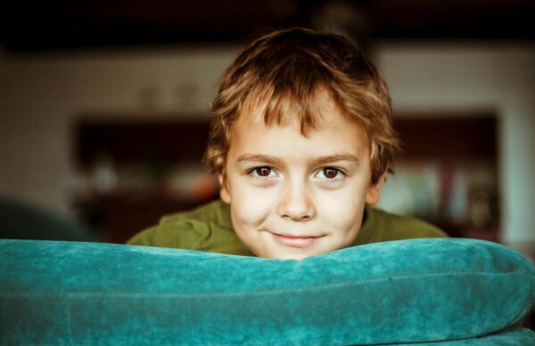 boy in green shirt smiling