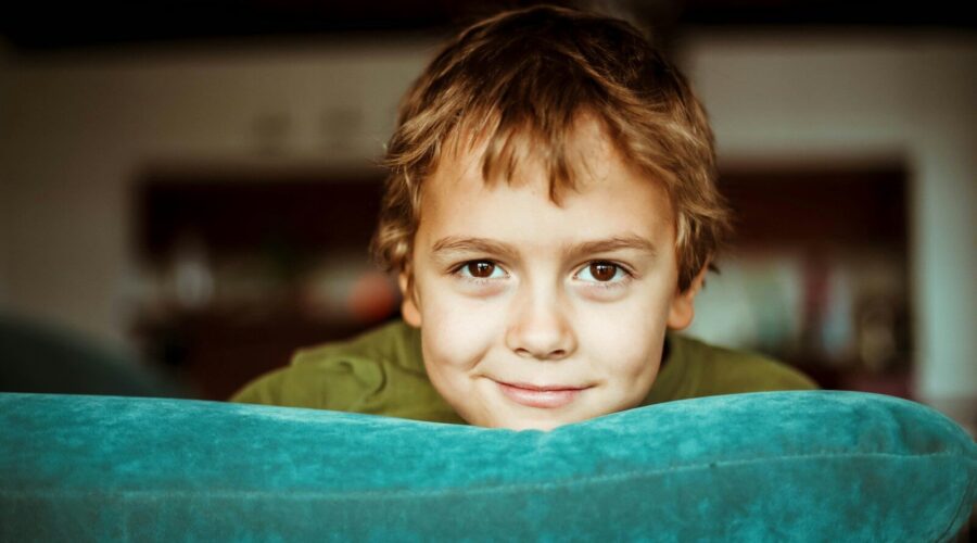 boy in green shirt smiling