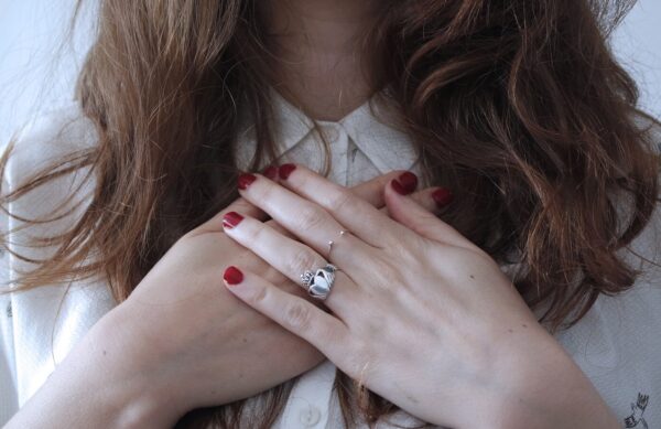 woman wearing silver-colored ring
