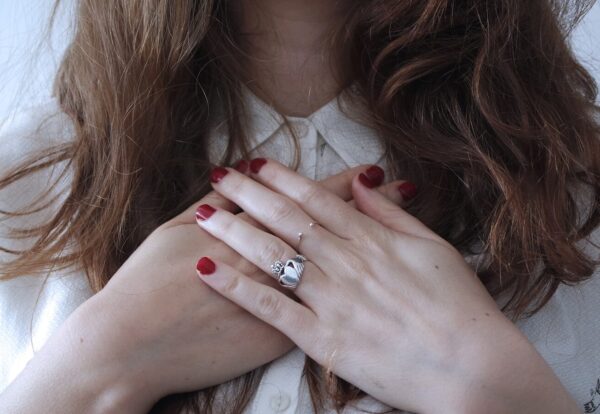 Photo by Giulia Bertelli woman wearing silver-colored ring