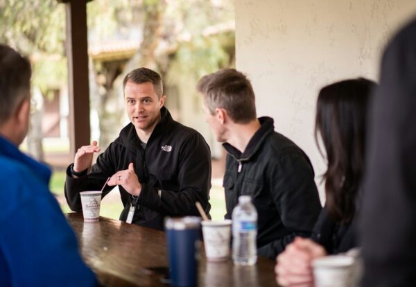a group of people sitting at a table