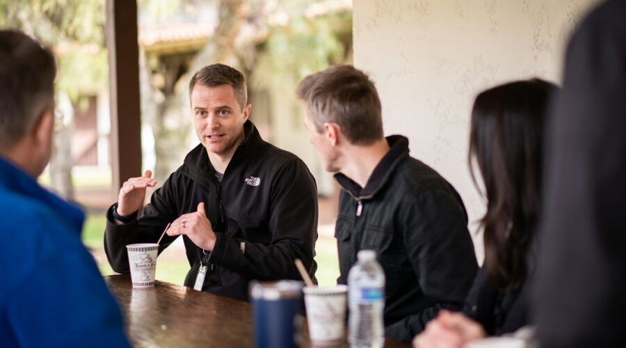 a group of people sitting at a table