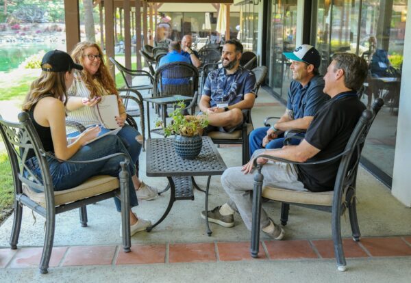 Photo by Small Group Network people sitting on gray metal chairs during daytime